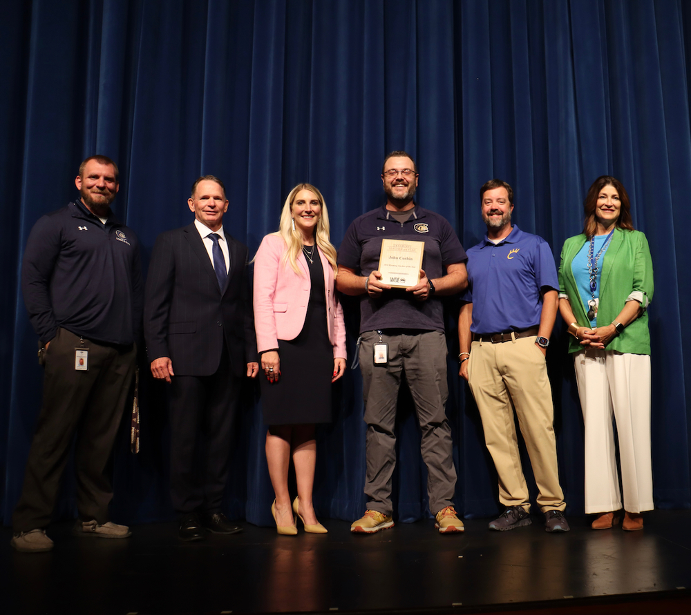 Mr. John Corbin receiving his award.