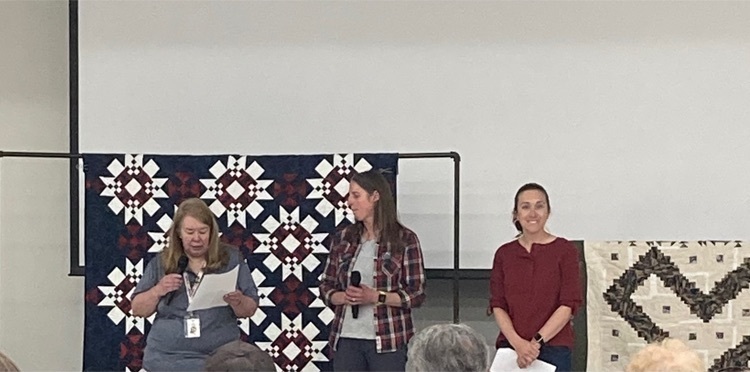 Cody Middle School Scholars presenting their Quilts of Valor.